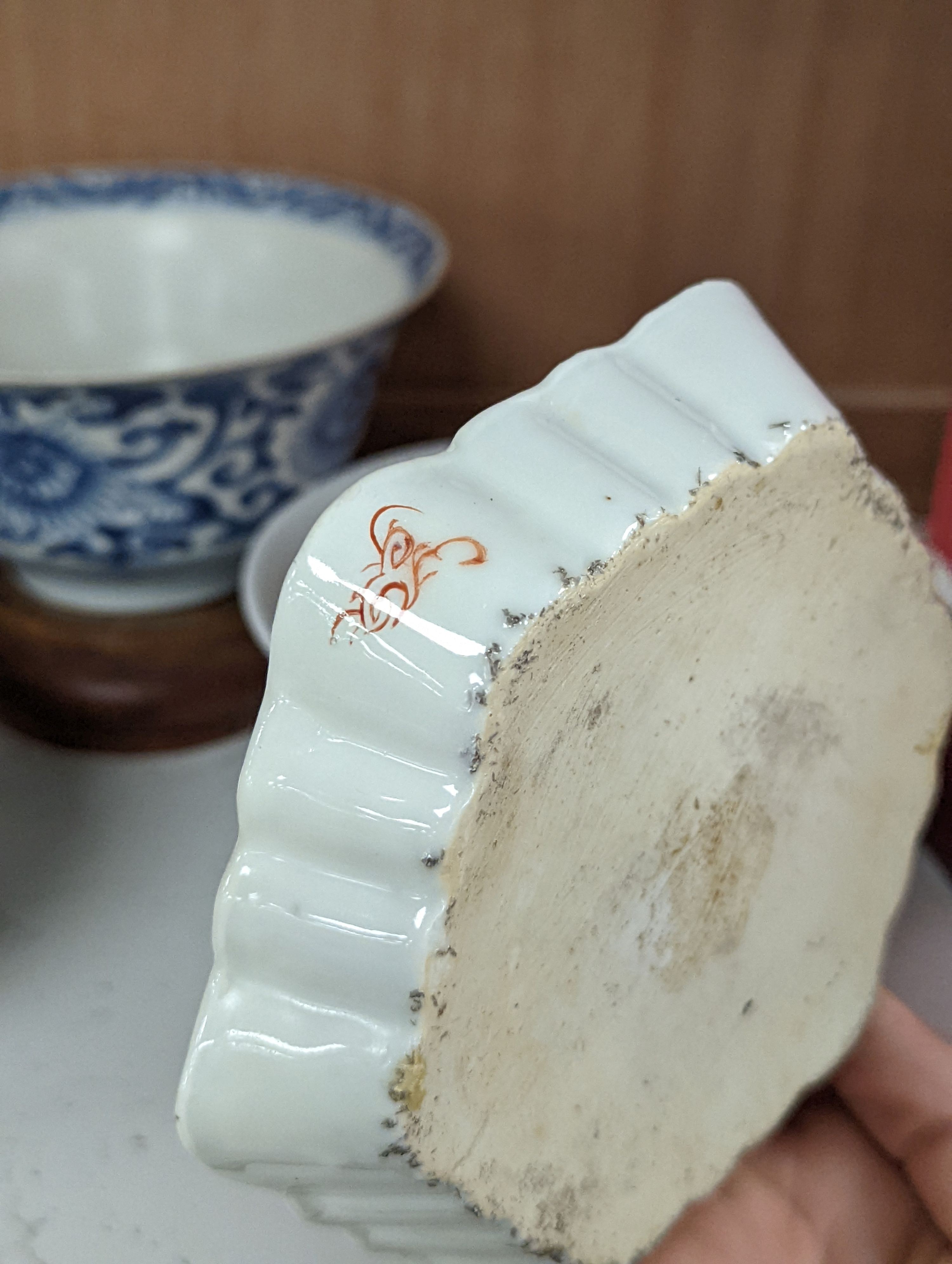 A Chinese blue and white bowl, Kangxi, 15cm. diam., a famille rose teapot stand, Yongzheng, and two doucai bowls